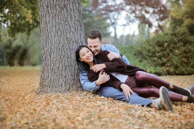 how to find your soulmate - image of a couple hugging next to a tree